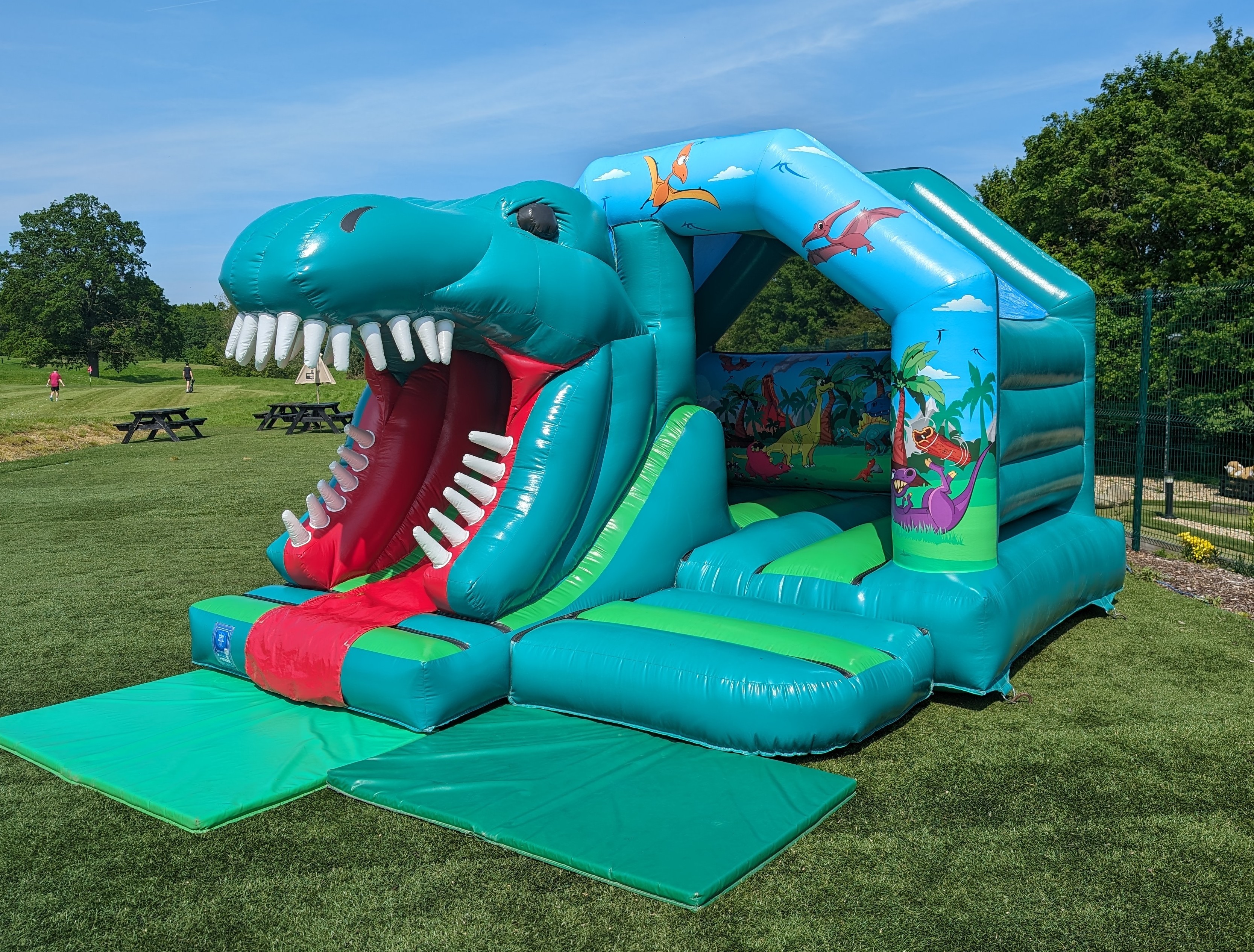 Dinosaur Bouncy Castle with Slide set up in Bishop's Stortford