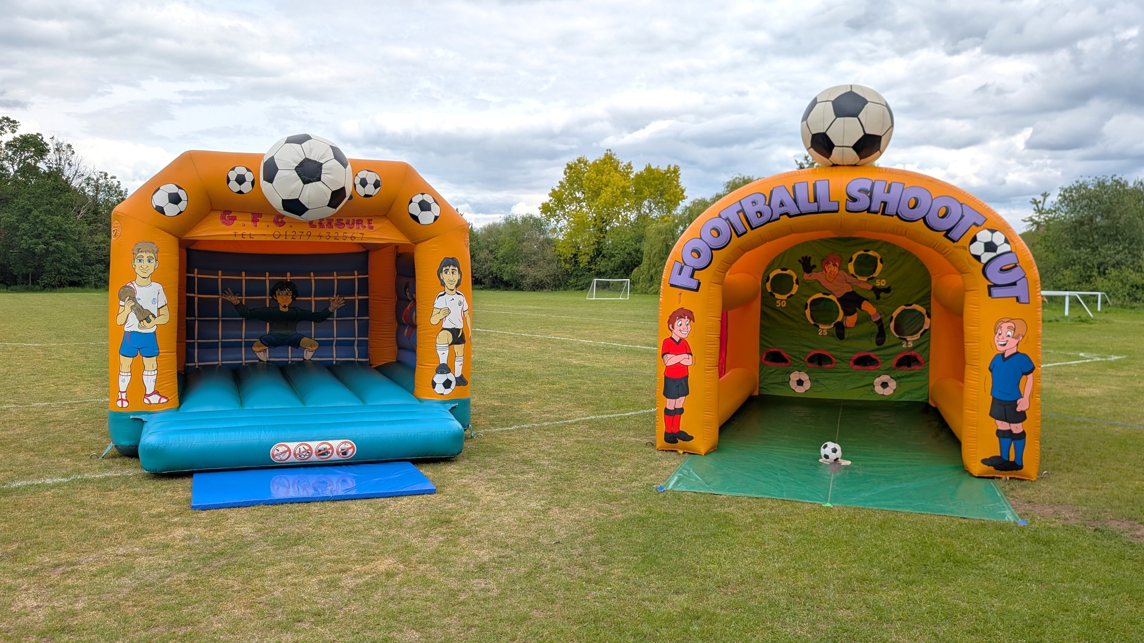 football bouncy castle and inflatable football shootout game on a field outdoor hire