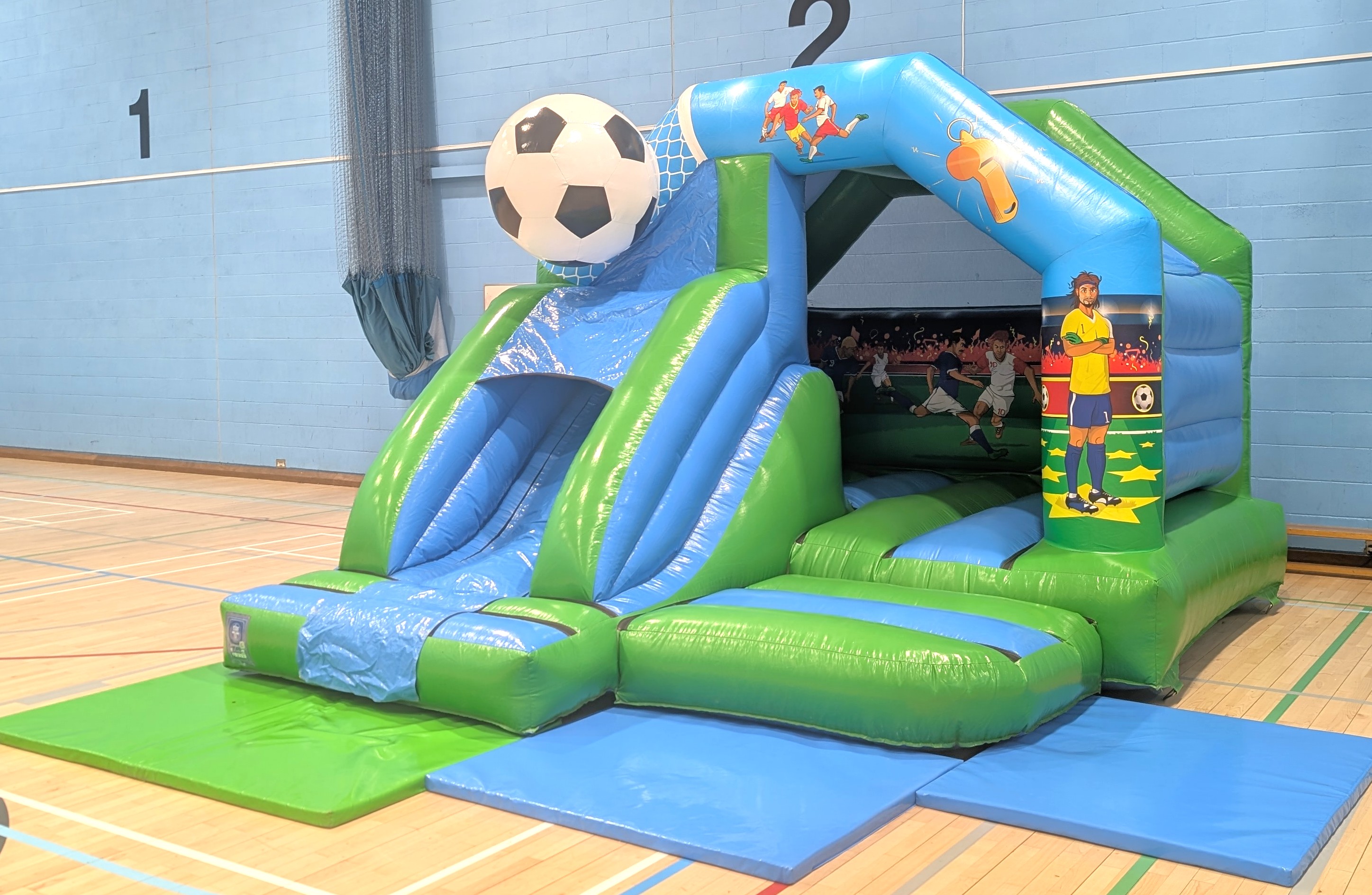 Football bouncy castle with slide in mark hall, harlow