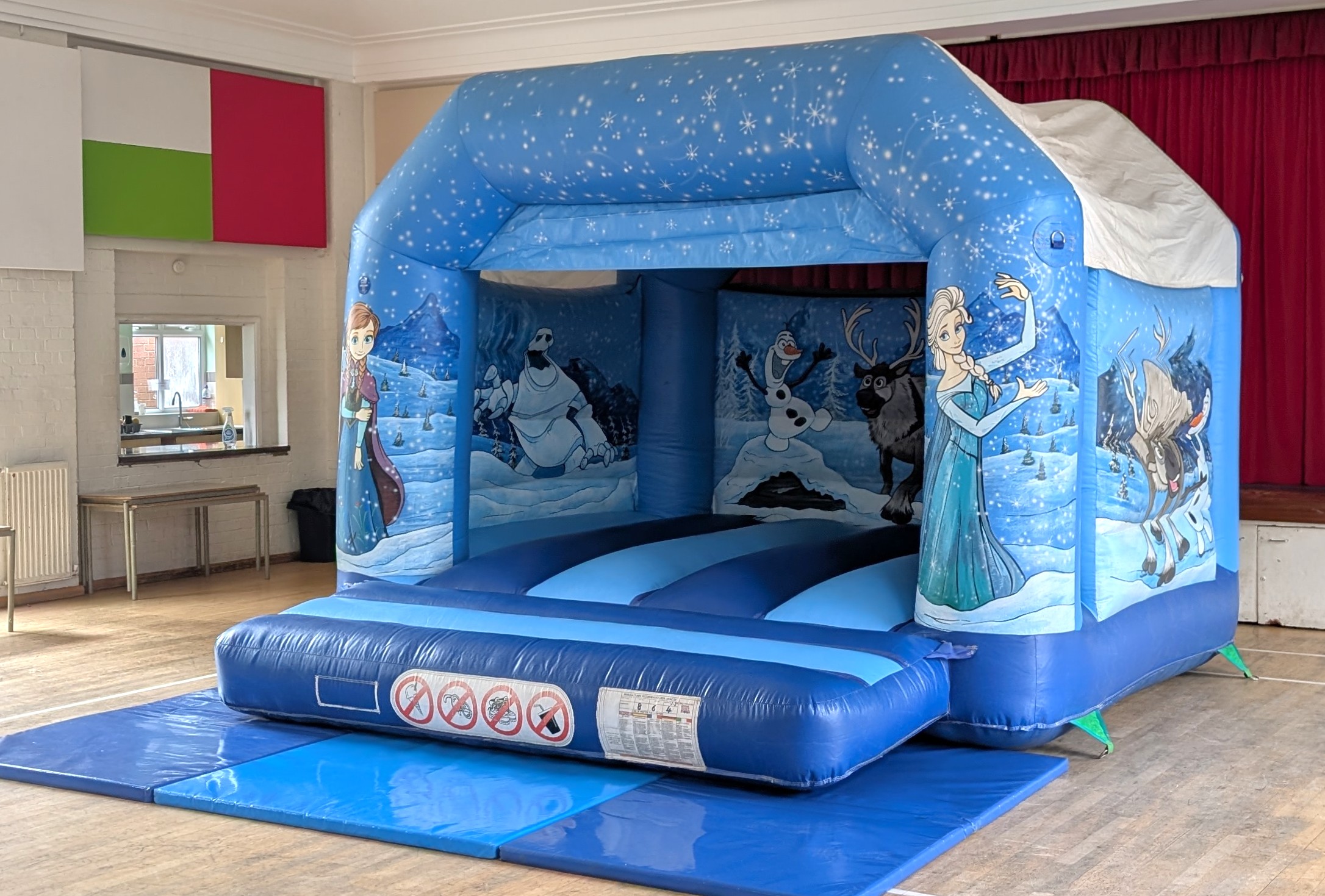 Frozen bouncy castle hire set up inside a hall in Loughton | Indoor Party