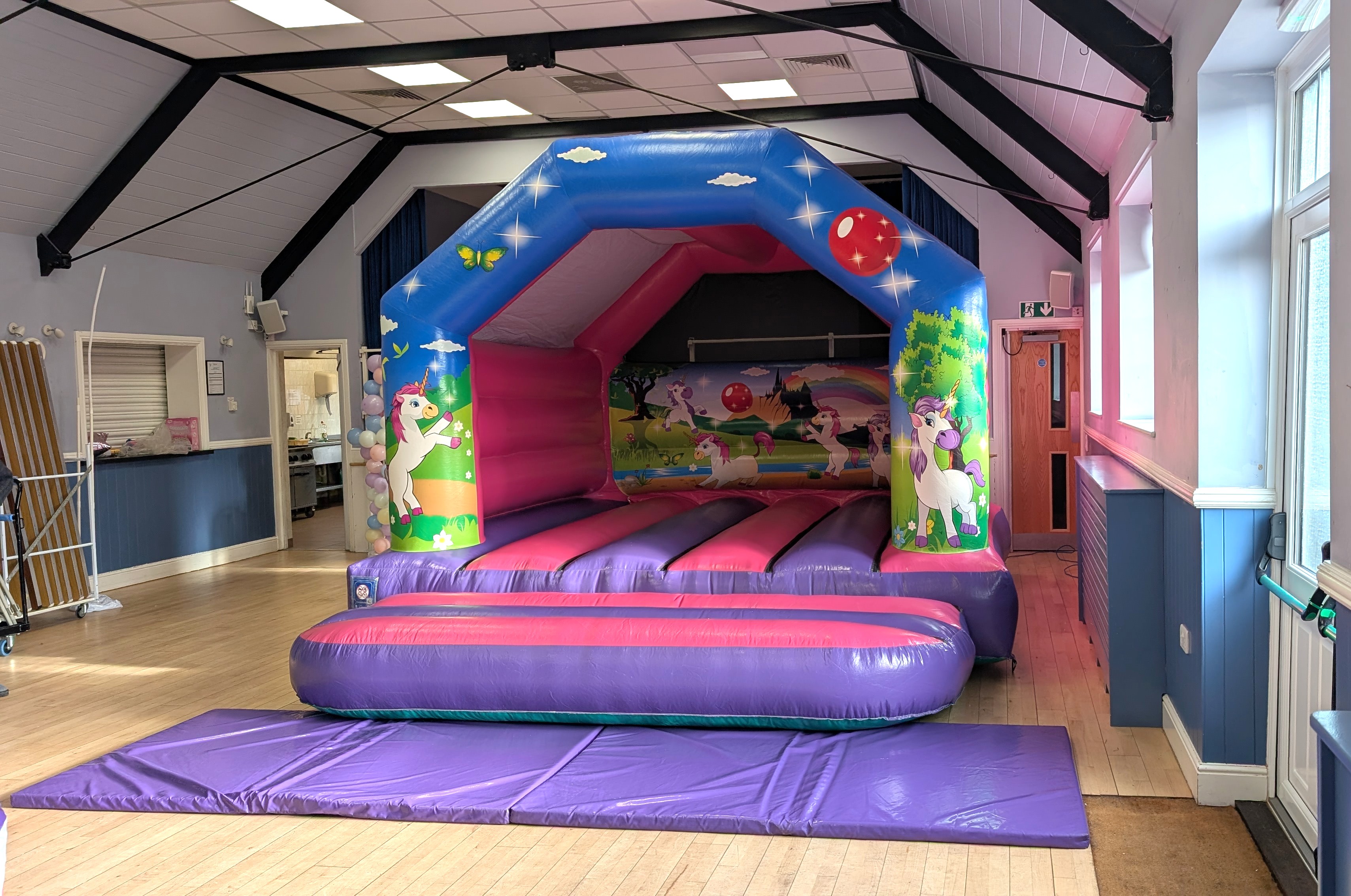Unicorn bouncy castle set up in the silver jubilee hall in takeley