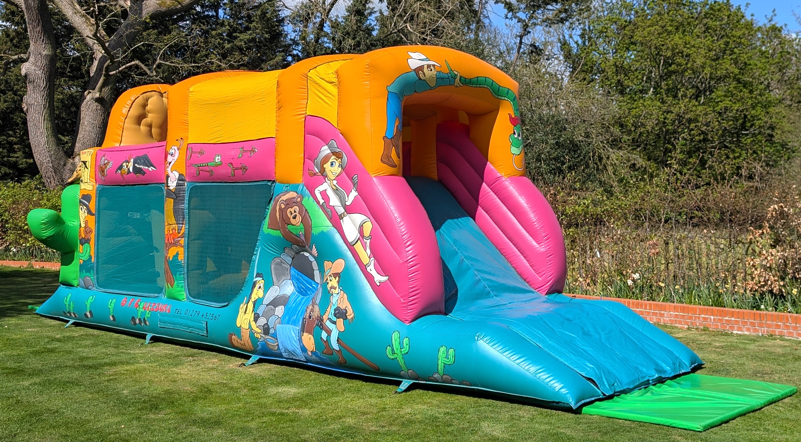 Wild west cowboy inflatable obstacle course set up in a garden in Ware